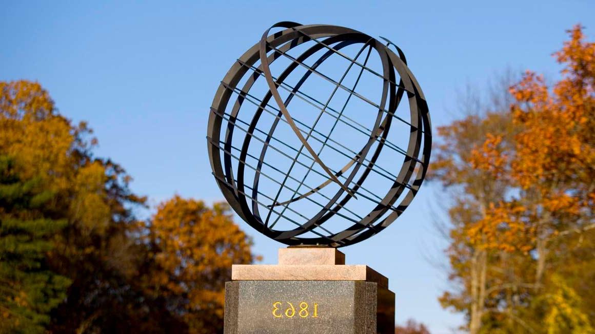 The globe at the entrance to Bryant University